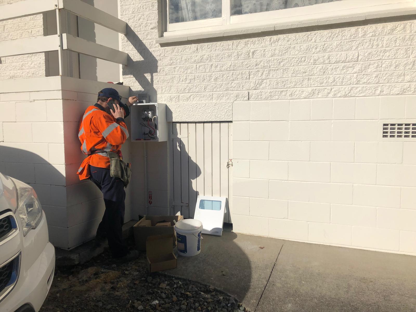 Knight Electrical Solutions electrician checking a meter on site